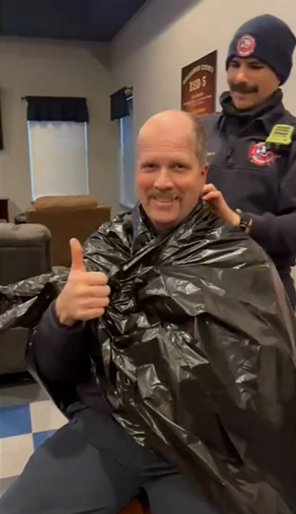 Jarrell Fire Department Chief Stewart shaves head for colleague with brain tumor.