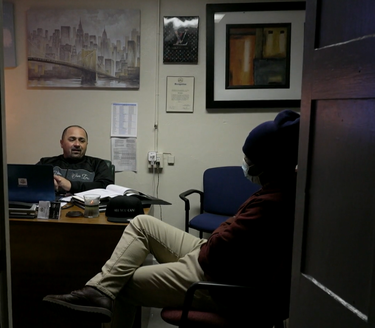 Ralph Rodriguez talking with Rashawn Turner in his office