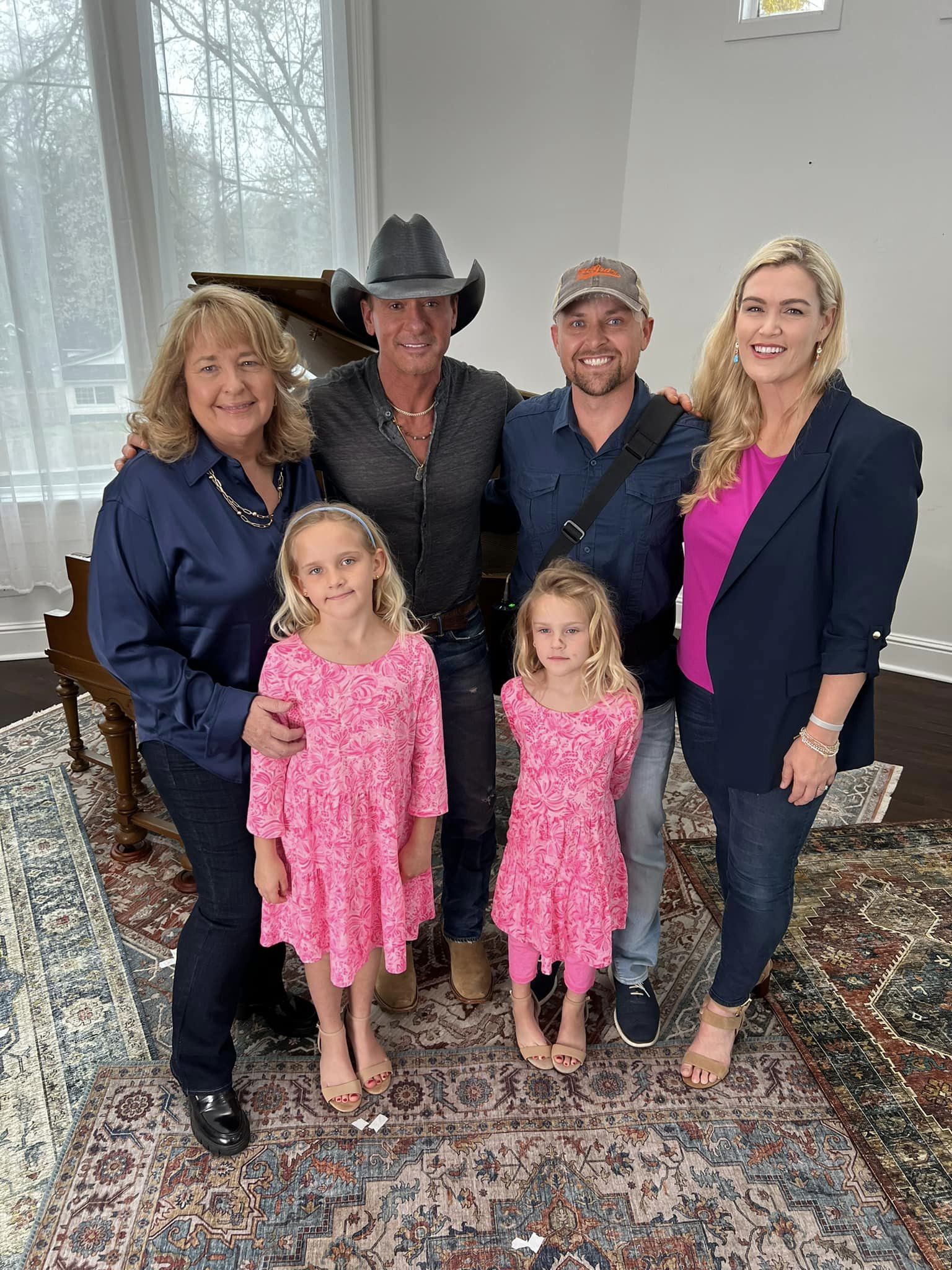 Tim McGraw smiles with Michael Hugo and family.