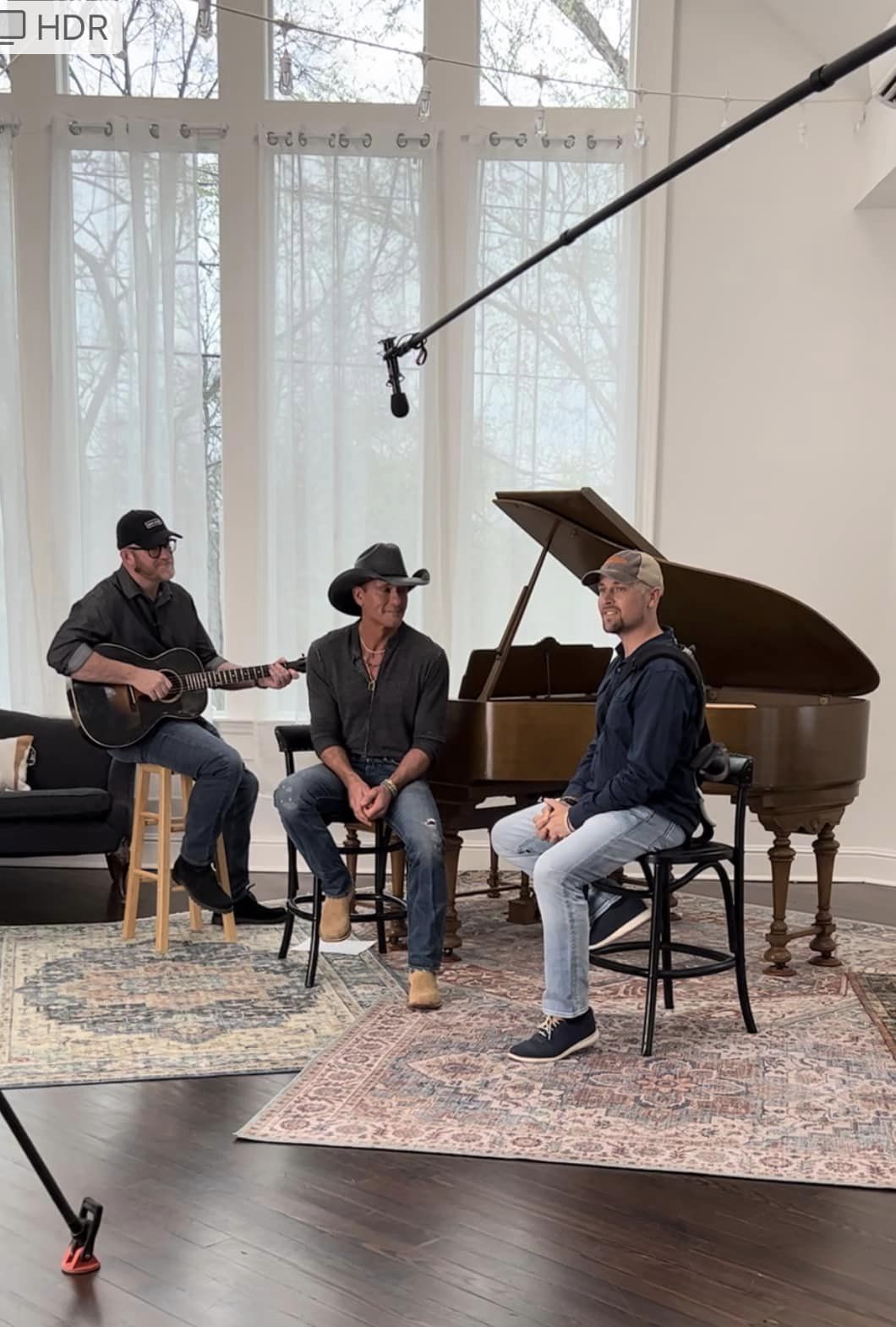 Tim McGraw sits with guitar player and Michael Hugo in Nashville, TN.