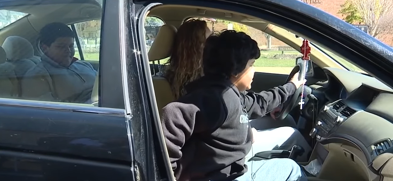 brother demonstrates how he steered the car during mom's seizure. 