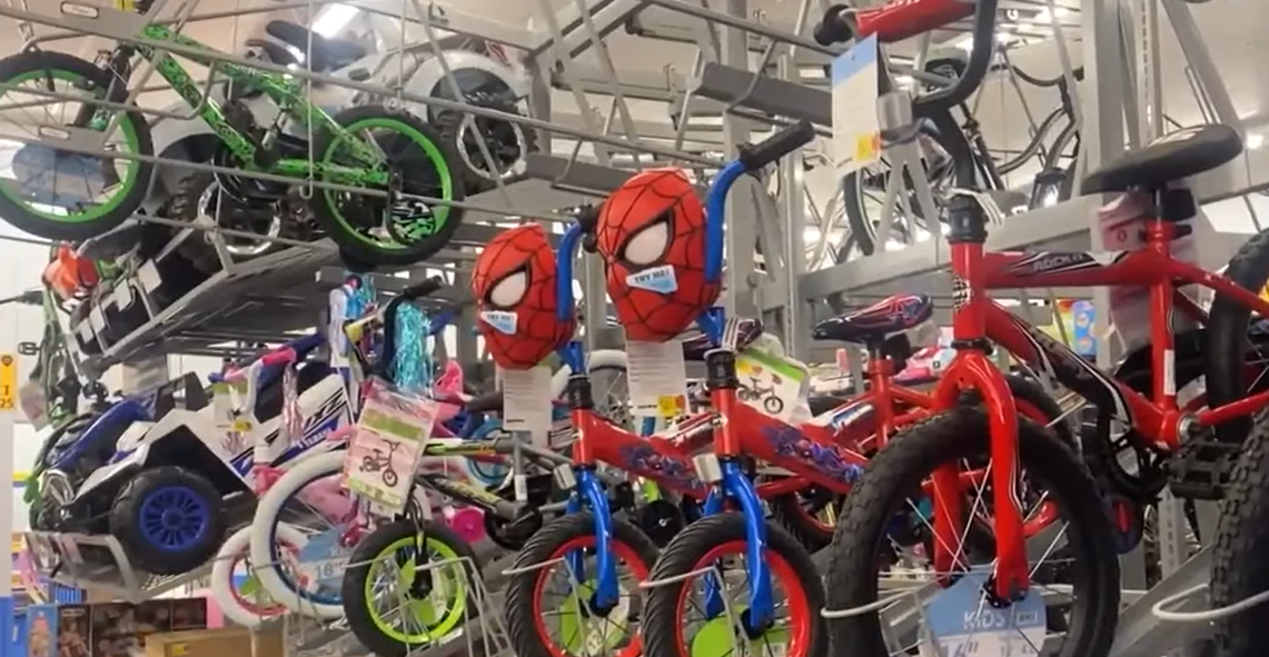 Spider-Man bikes hanging up at Walmart.