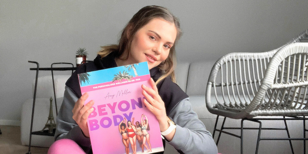 woman holding a Beyond Body book.