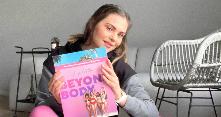 Woman holding her Beyond Body book