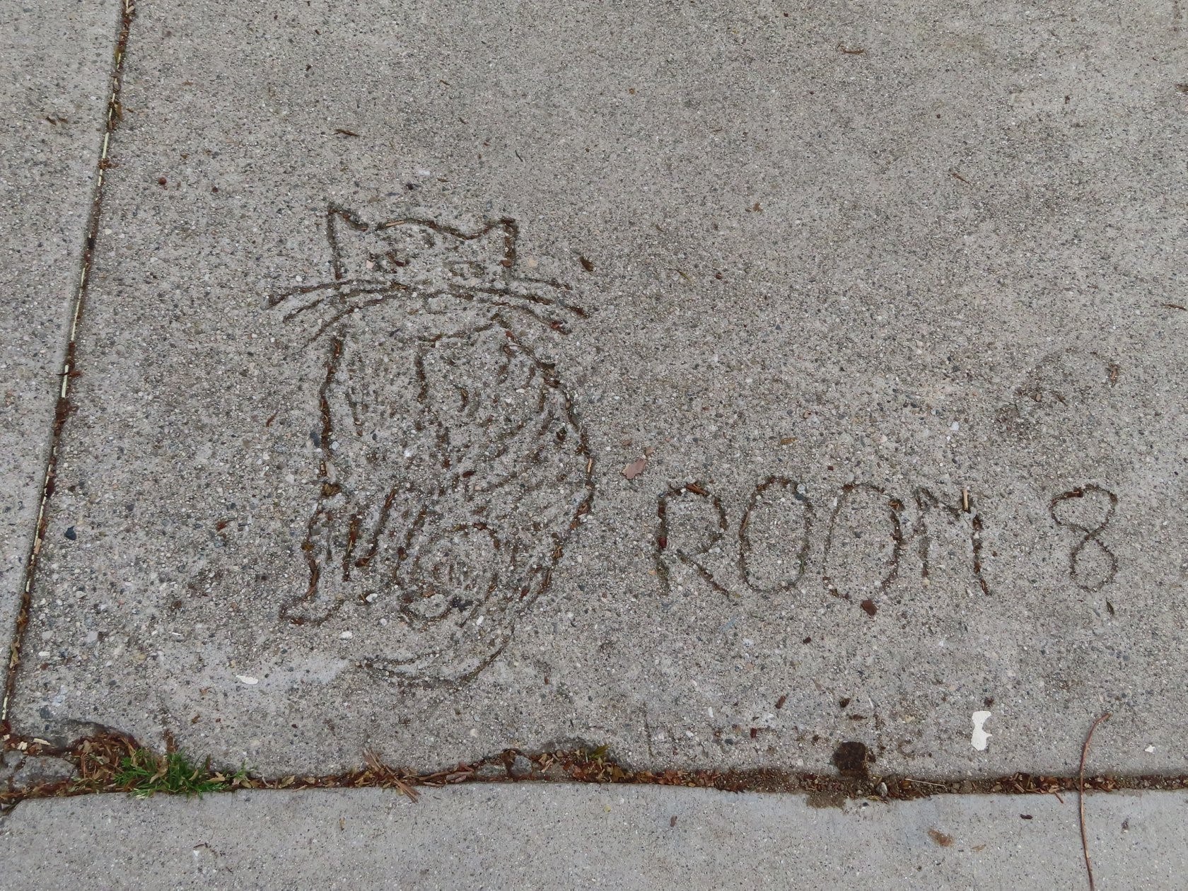 etchings about Room 8 in school's cement walk.