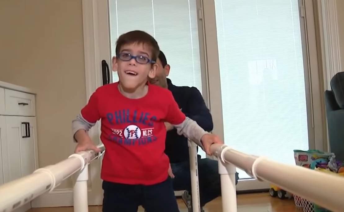 William Getty learning to walk using his PVC pipe parallel bars