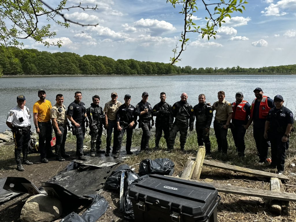 NYPD rescue workers pose after rescuing horse from Orchard Beach in the Bronx.