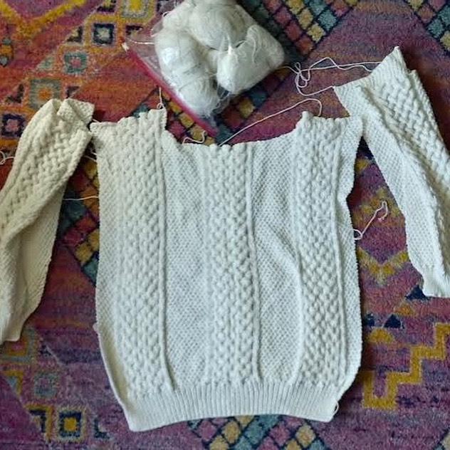 half-finished white sweater.