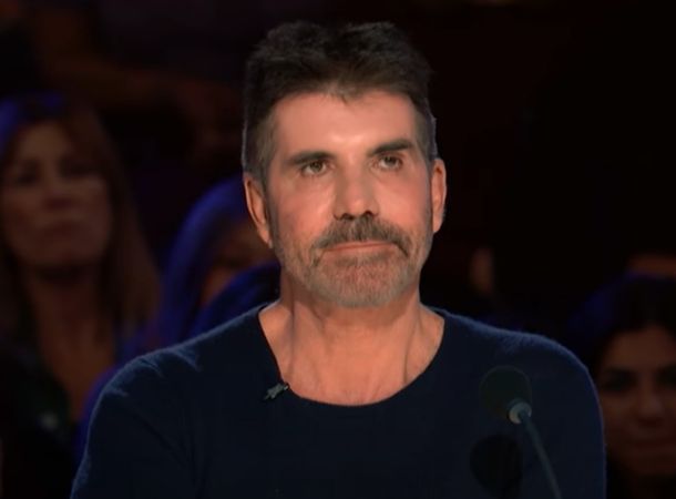 Judge Simon Cowell is impressed by a contestant's voice. 
