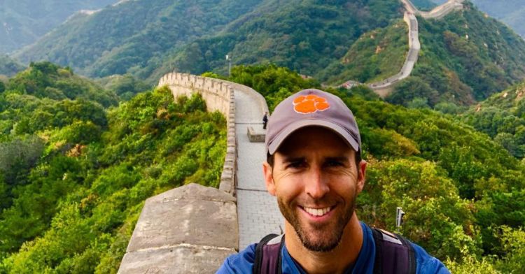 A teacher visits China as part of his world travel goals.