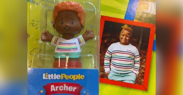the little people toy modeled after archie, next to a picture of archie