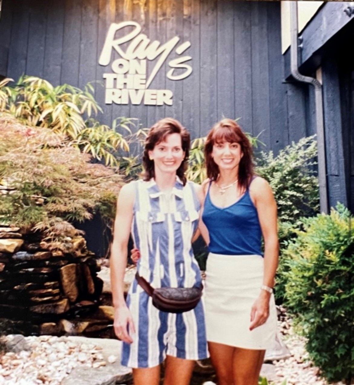 A photo of Lynn and someone else outside of Ray's on the River decades ago.