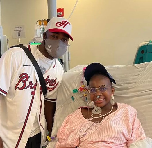 Baseball player Michael Harris II spends time with child patients.
