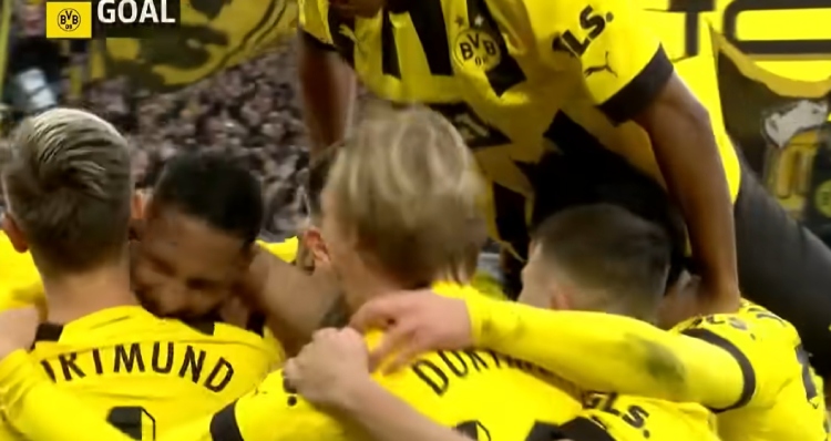 Sébastien Haller is embraced by teammates after scoring goal.