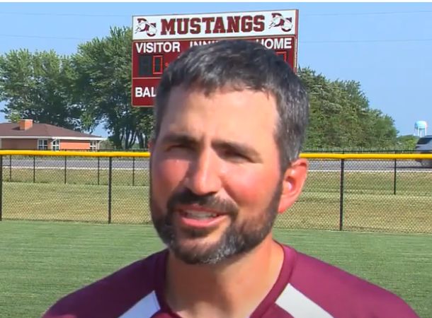 Zach Dunlavy has been his daughter's softball coach for 14 years.