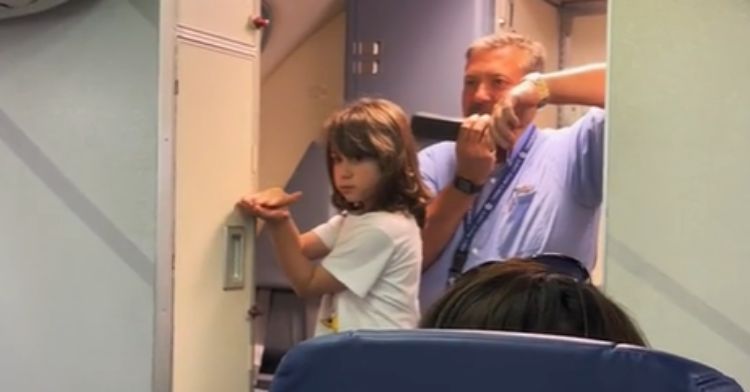 A flight attendant announces that this little girl has beaten cancer.