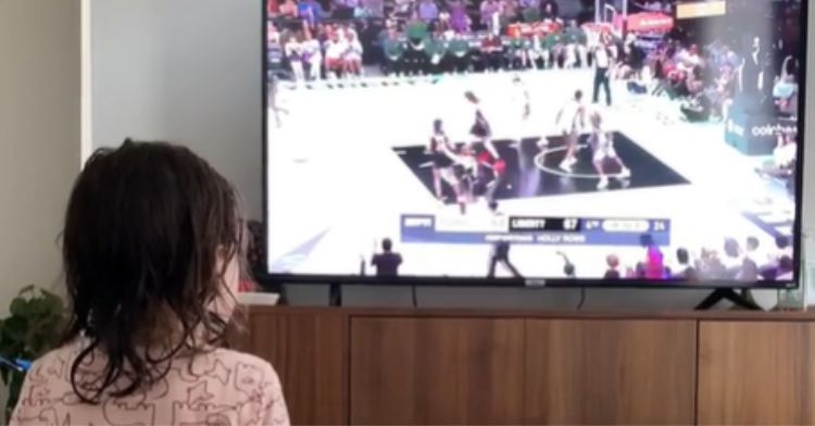 This dad watches women's sports to inspire his daughter.