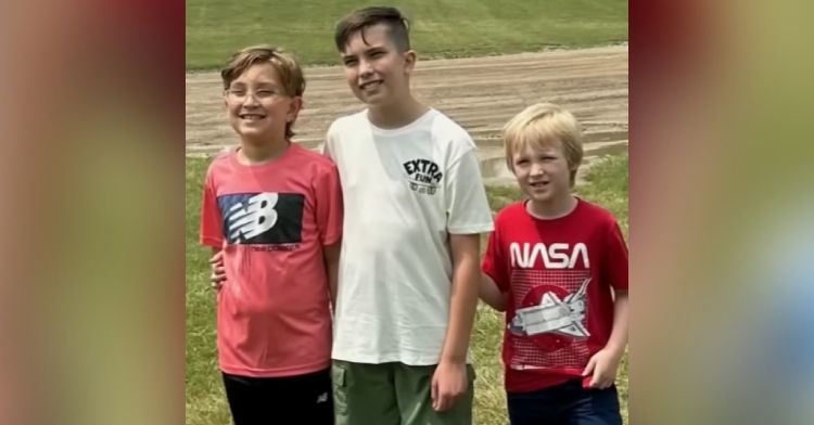 Weston, Noah, and Griffin smile for a photo together.