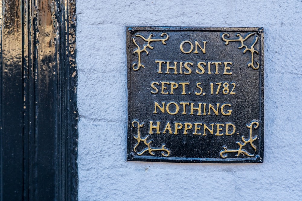 Plaque on a building that reads "On this site Sept. 5, 1782 nothing happened."