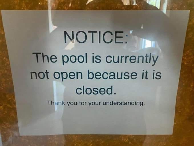 Sign that reads "Notice: The pool is currently not open because it is closed. Thank you for your understanding."