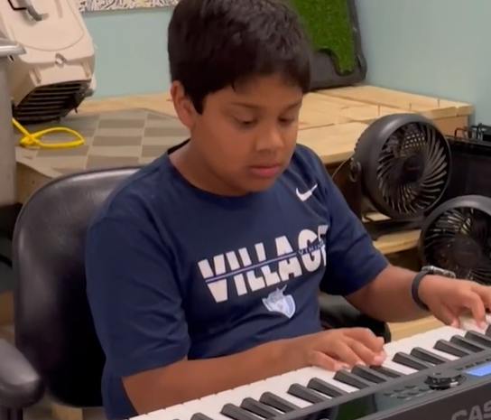 Yuvi plays the piano for shelter dogs to calm them down.