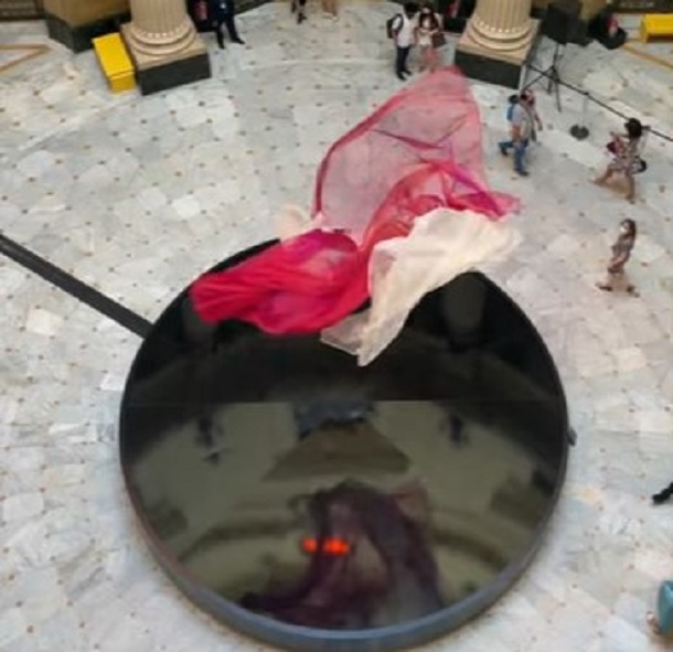 Air fountain pictured from above showing flowing material over the circular base.
