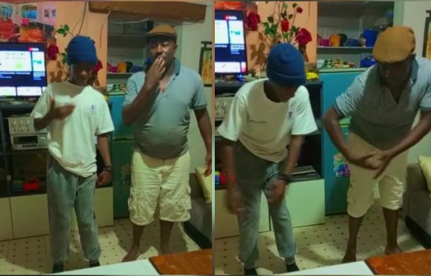 father and son dancing together