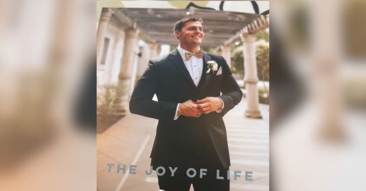 A wedding photo showing the groom unbuttoning his tuxedo jacket with a caption that doesn't match (The Joy of Life)