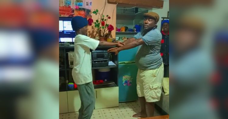 Image shows a father dancing with his son