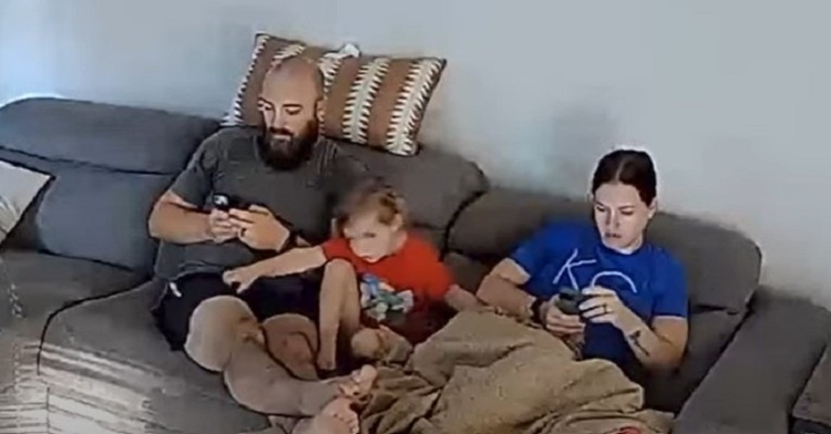 Family sitting quietly before a fart interrupts the peace.