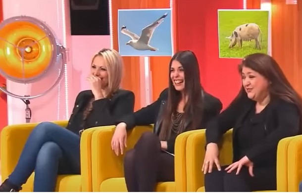 Image shows three talk show participants laughing. There are images of animals behind each participant that match their unique style of laughter.