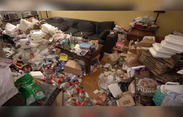 Image shows Olga's living room before cleaning with trash and debris all around. Olga suffers from depression and hasn't cleaned in years.