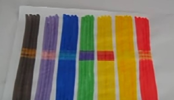 Image shows seven different colors drawn on a white background. The center of the image shows how color-changing markers "magic pen" changes the colors.