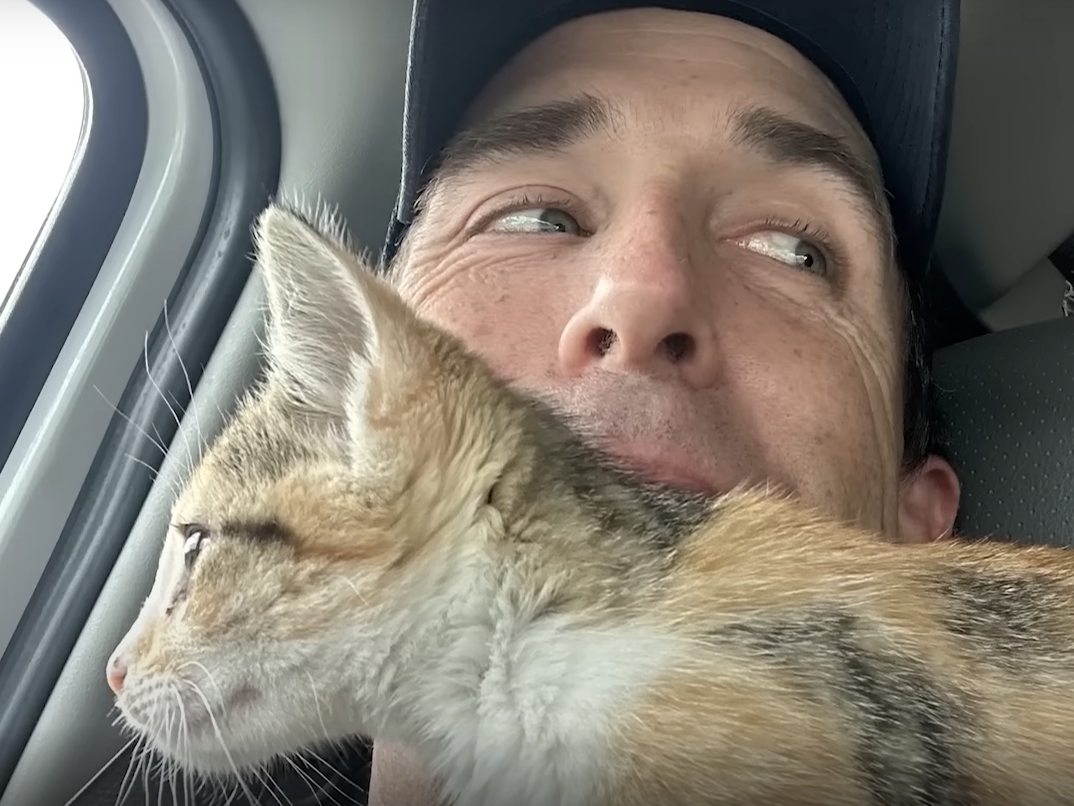 Officer Rugg with kitten in a selfie.