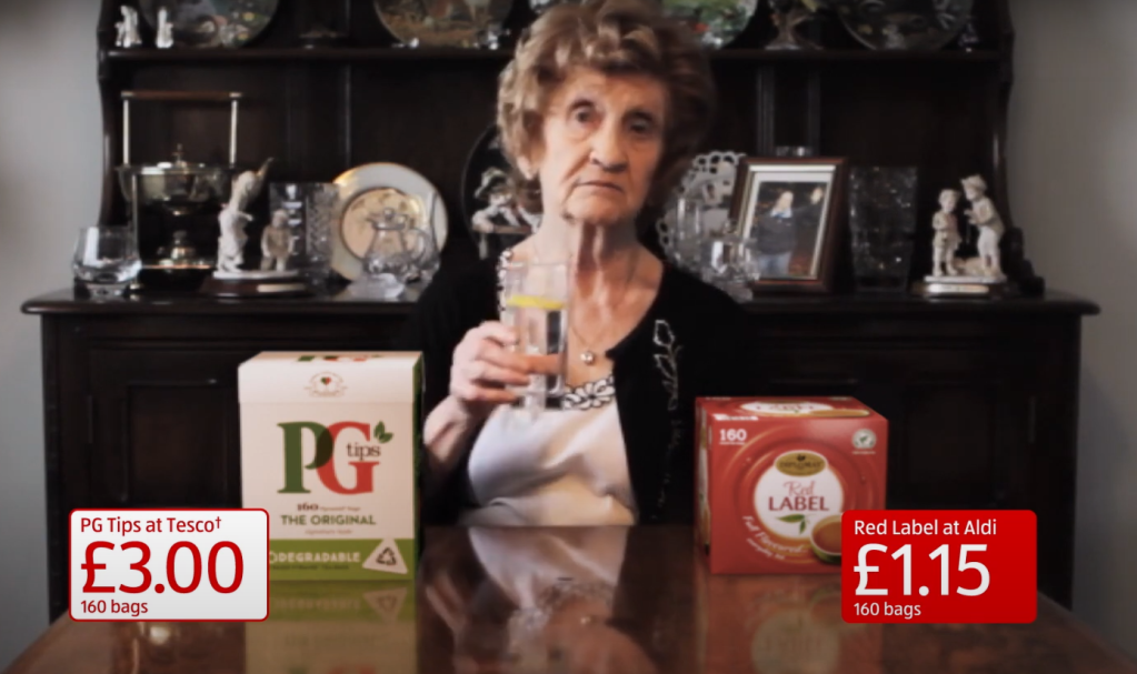 ALDI ad with grandma sitting with glass of gin.