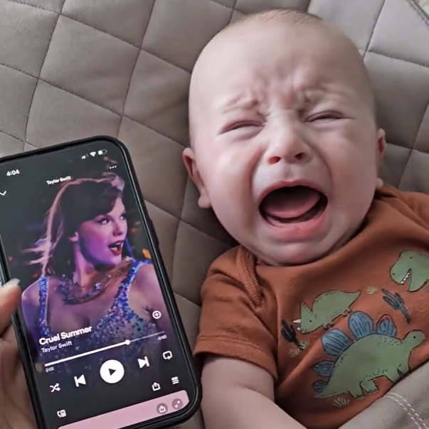 Baby cries until he listens to Taylor Swift.