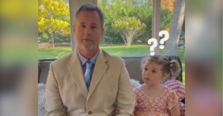 daughter sitting next to dad and looking confused