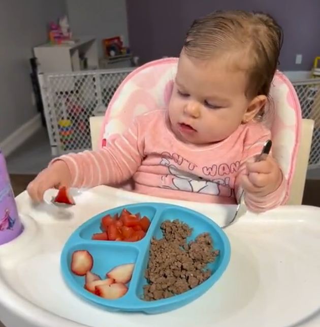 Baby shows perseverance in using a spoon