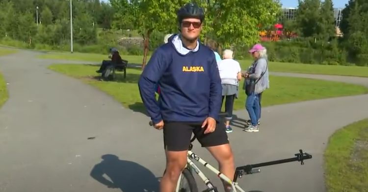 This cyclist rides his bike backwards.