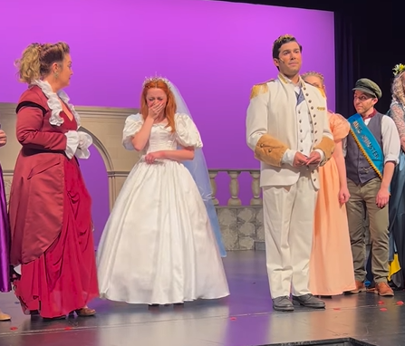 Prince Charming actor proposes to Cinderella on stage.
