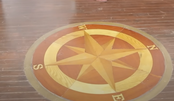 a wooden compass emblazoned on the floor