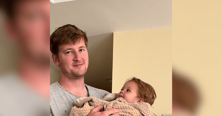 dad holds baby girl