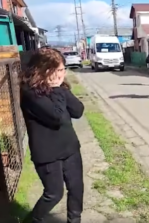 María Angèlica González covers her face with her hands from being overwhelmed as she approaches the son who was taken from her 43 years ago that she thought died, Jimmy Lipper Thyden.