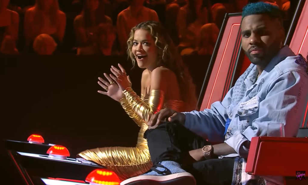 The Voice Australia judge Rita Ora is excited to hear singer Levi X perform. Jason Derulo looks on.