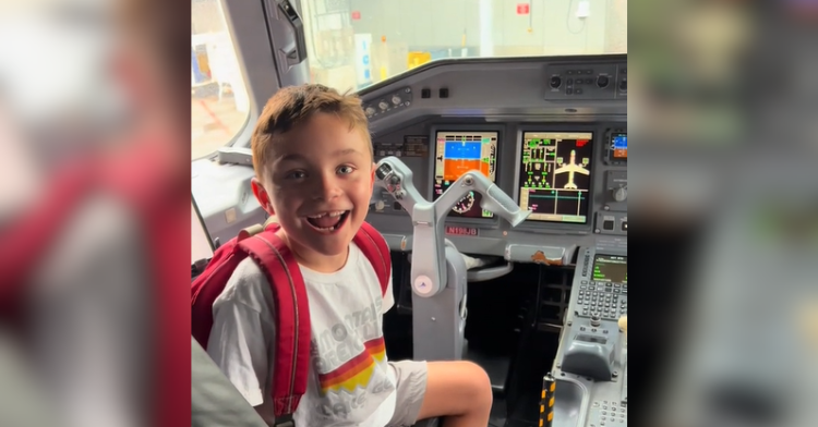 kid in cockpit of plane