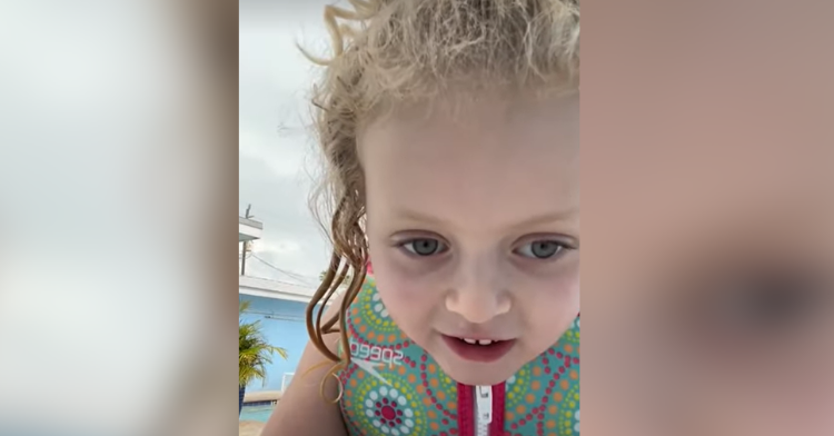 little girl talks to camera