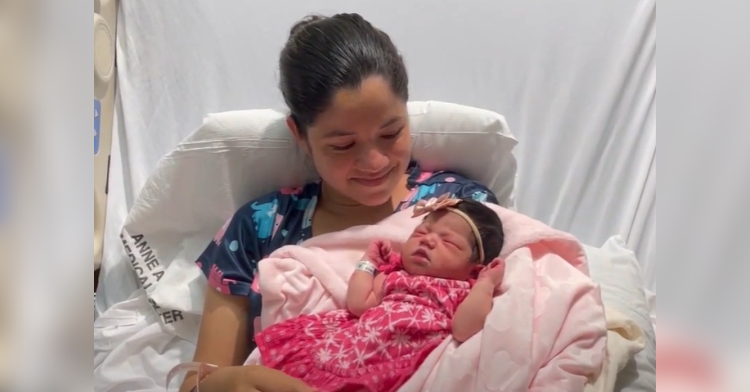 mother in hospital bed with newborn