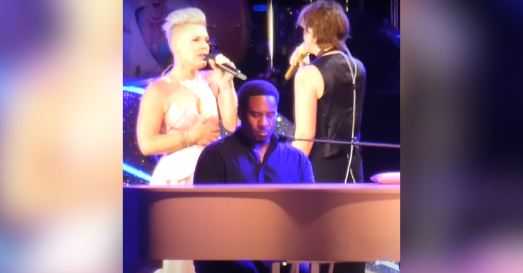 pink and brandi carlile sing next to pink piano