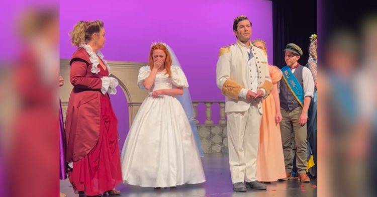 Prince Charming actor proposes to Cinderella on stage.