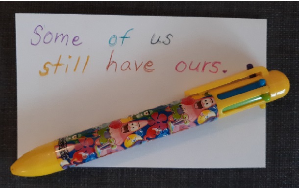 1990s School supplies included these multicolored pens. Image shows a SpongeBob-themed pen with six colors laying on a notecard that says, "Some of us still have ours. 